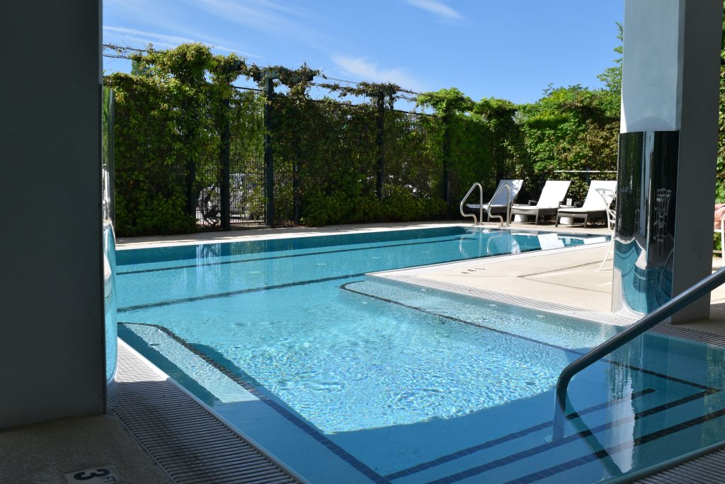 Proximity Hotel Pool with lounge chairs