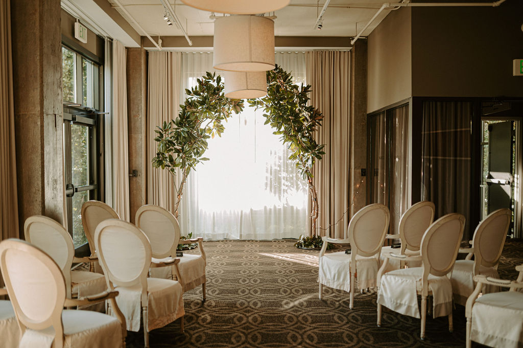Jordan Vines | Vines Studios Latham Room Event Space at Proximity Hotel se theatre style for an intimate wedding.