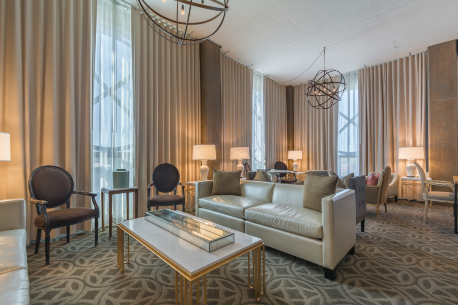 Proximity Hotel City Suite Proximity Hotel City Suite with floor-to-ceiling windows overlooking Greensboro.