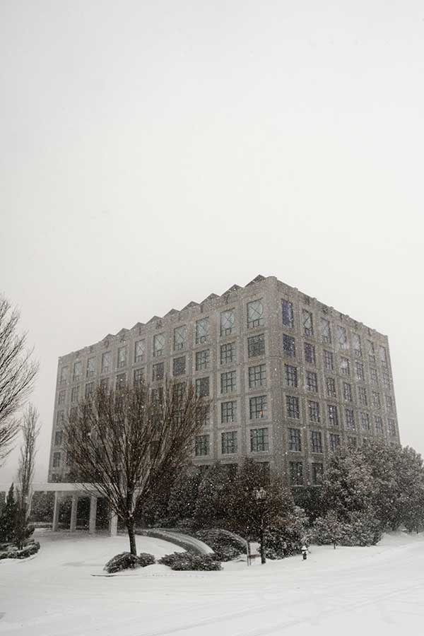 Proximity Hotel | Photos by Griffin Hart Davis Photography Proximity hotel facade on a snowy day in January.