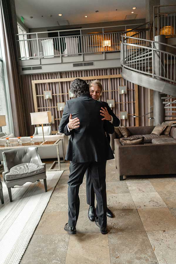 Sam | Photos by Griffin Hart Davis Photography The groom greets his groomsmen as they arrive in the social lobby.