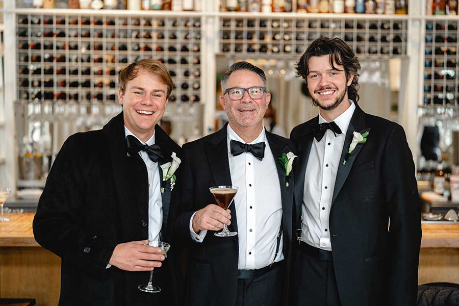 Sam | Photo by Griffin Hart Davis Photography The Groom and a couple groomsmen share a beverage at the bar in Print Works Bistro