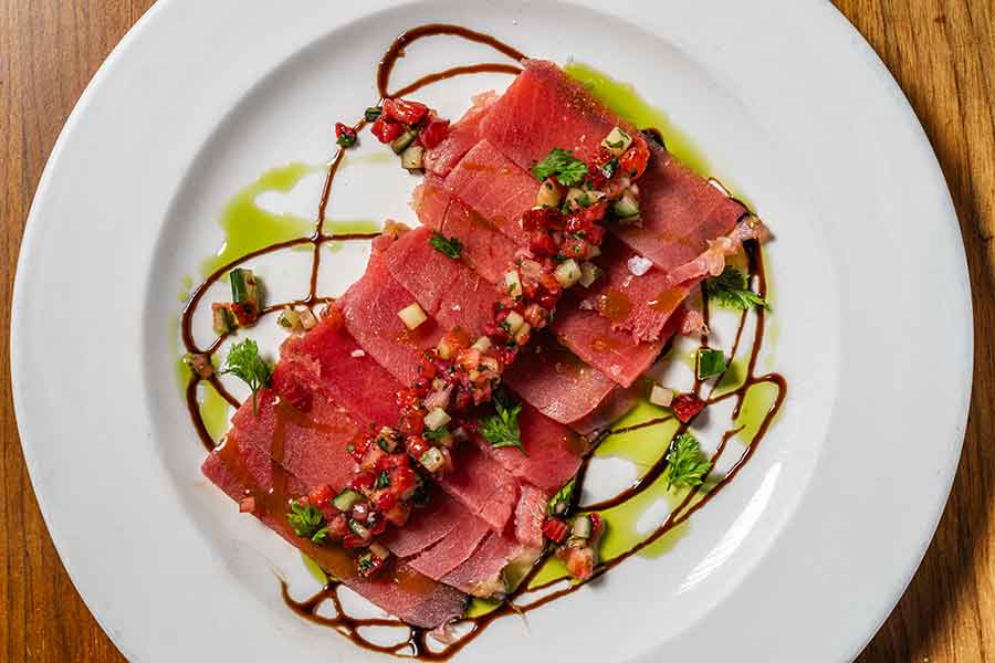 Tuna Crudo, pickled strawberry relish, charred scallion oil, balsamic glaze, sweet potato chips